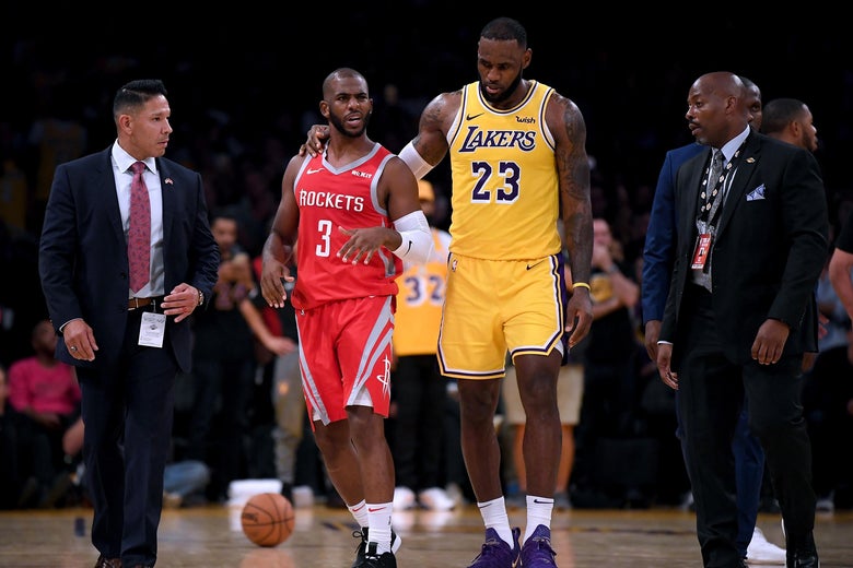 LOS ANGELES, CA - OCTOBER 20: LeBron James #23 of the Los Angeles Lakers escorts Chris Paul #3 of the Houston Rockets after a fight involving Rajon Rondo #9 and Brandon Ingram #14 during a 124-115 Rockets win at Staples Center on October 20, 2018 in Los Angeles, California. (Photo by Harry How/Getty Images)